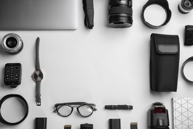 Photo of Flat lay composition with photographer's equipment and accessories on white background. Space for text
