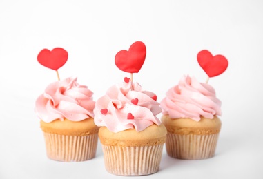 Photo of Tasty cupcakes for Valentine's Day on white background