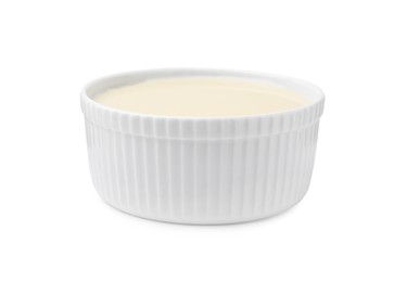 Bowl with condensed milk isolated on white