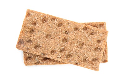 Photo of Fresh crunchy rye crispbreads on white background, top view