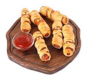 Cute sausage mummies served with ketchup isolated on white. Halloween party food