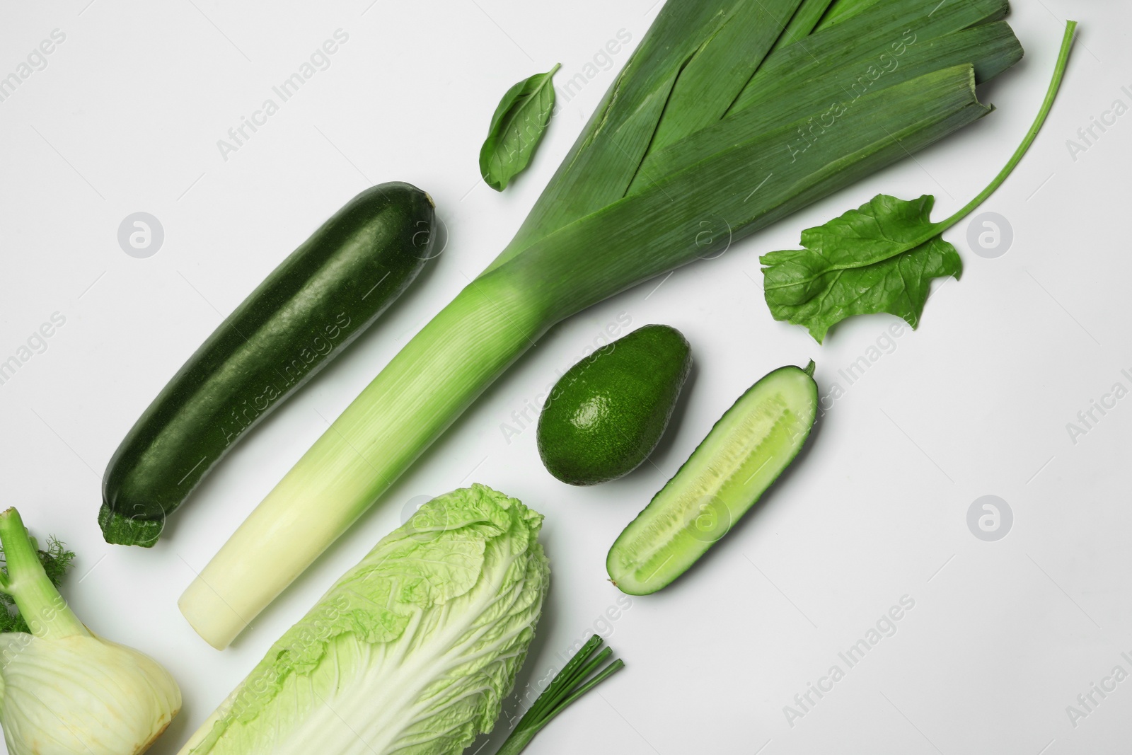 Photo of Flat lay composition with fresh ripe vegetables on white background