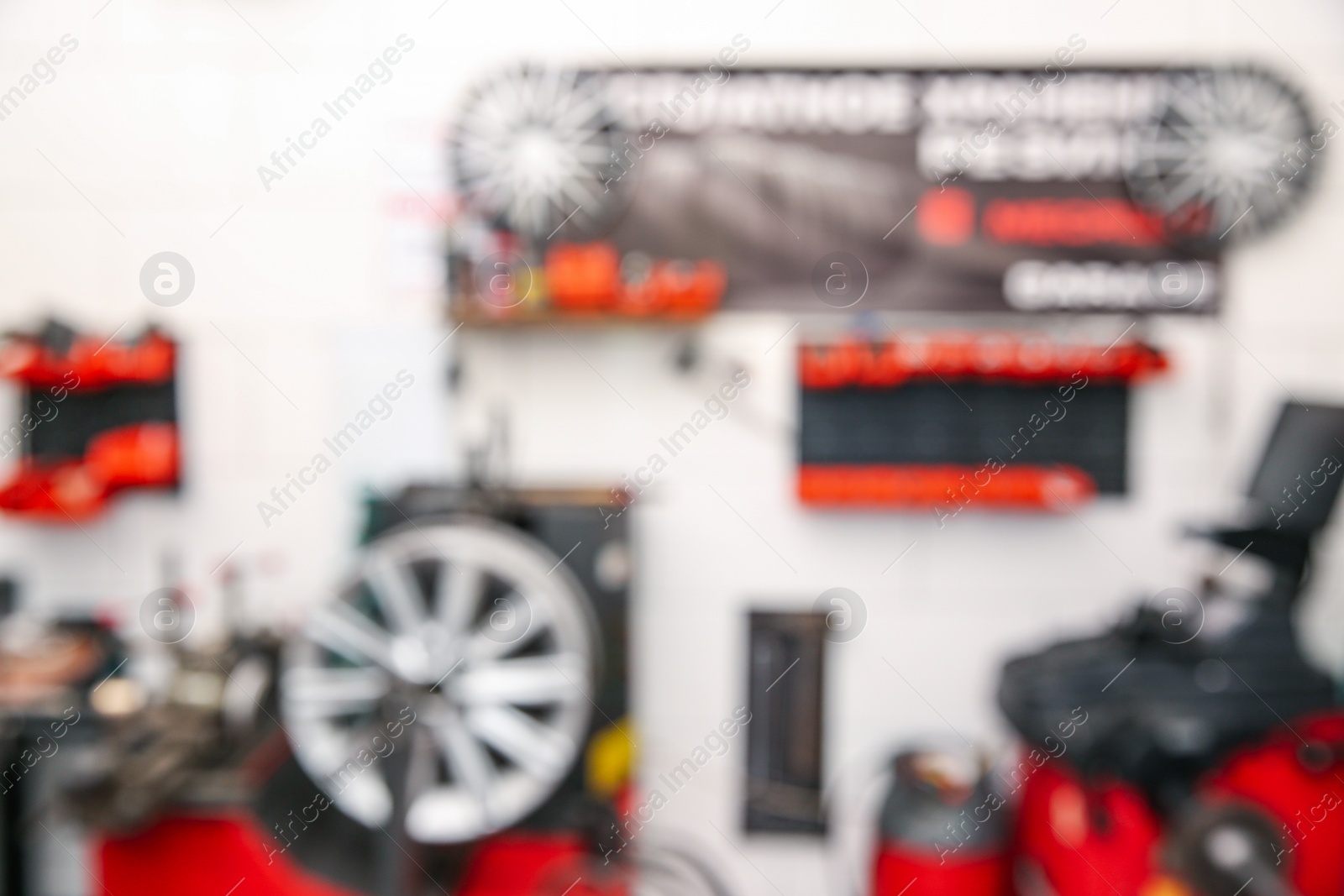Photo of Blurred view of modern tire service station