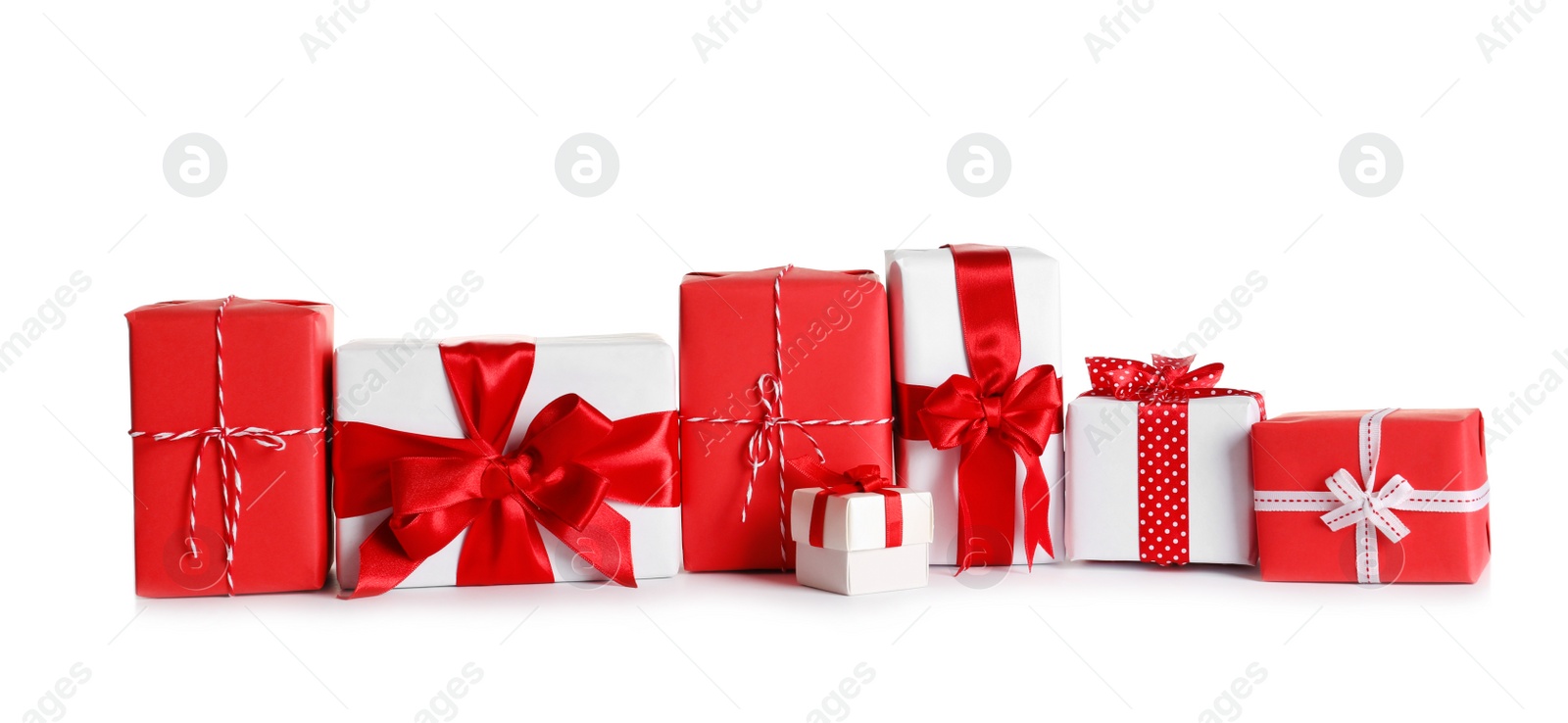 Photo of Beautifully wrapped gift boxes on white background