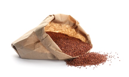 Paper bag with red quinoa on white background