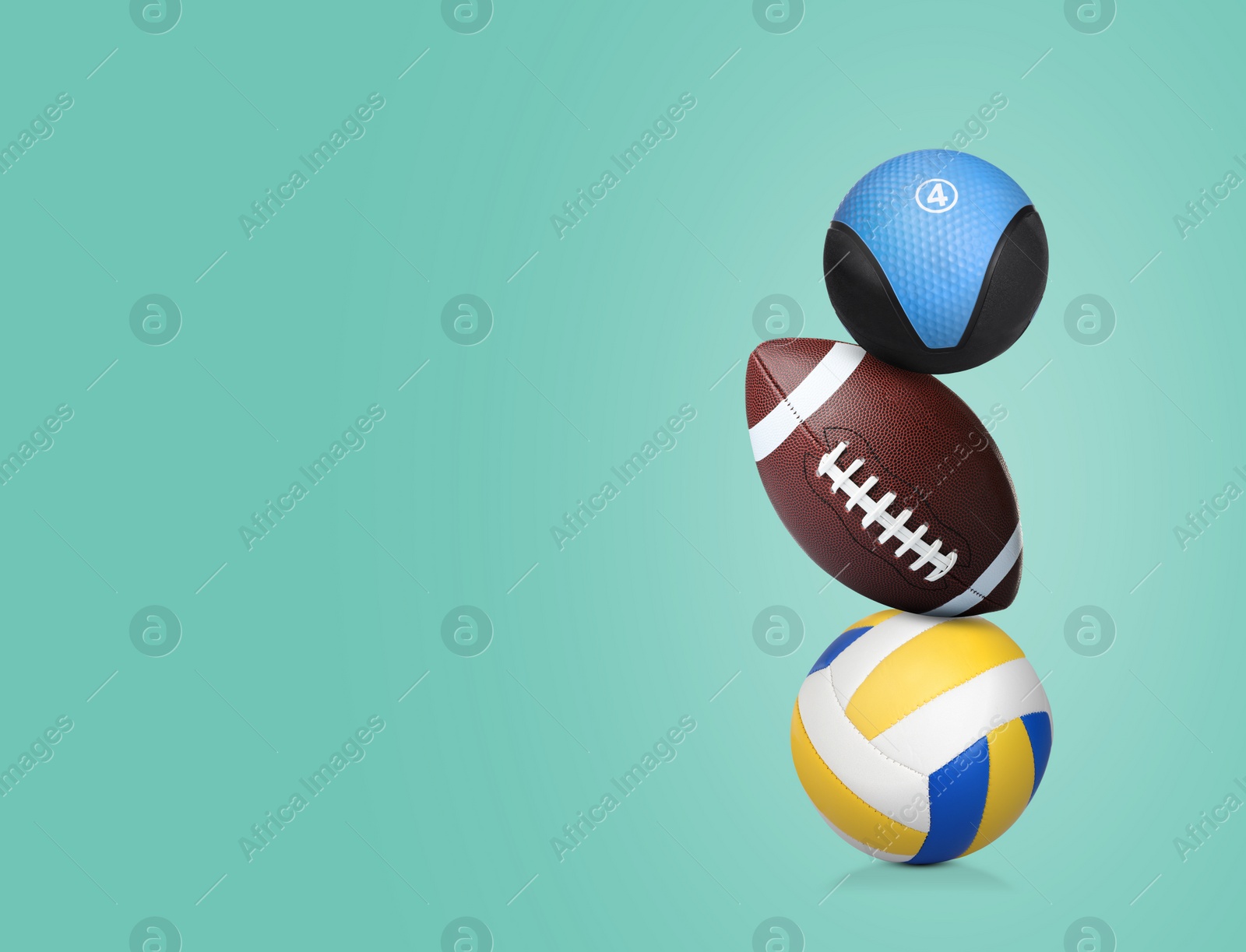 Image of Stack of sport and medicine balls on aquamarine background, space for text