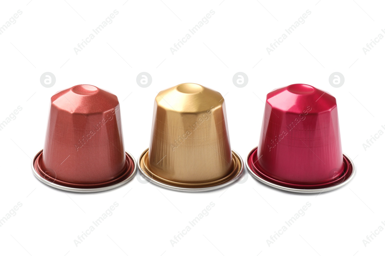 Photo of Three plastic coffee capsules isolated on white