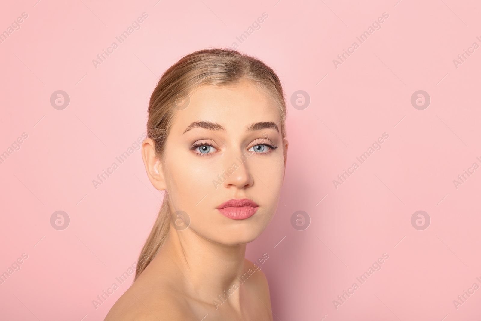 Photo of Portrait of young woman with beautiful natural eyelashes on color background. Space for text