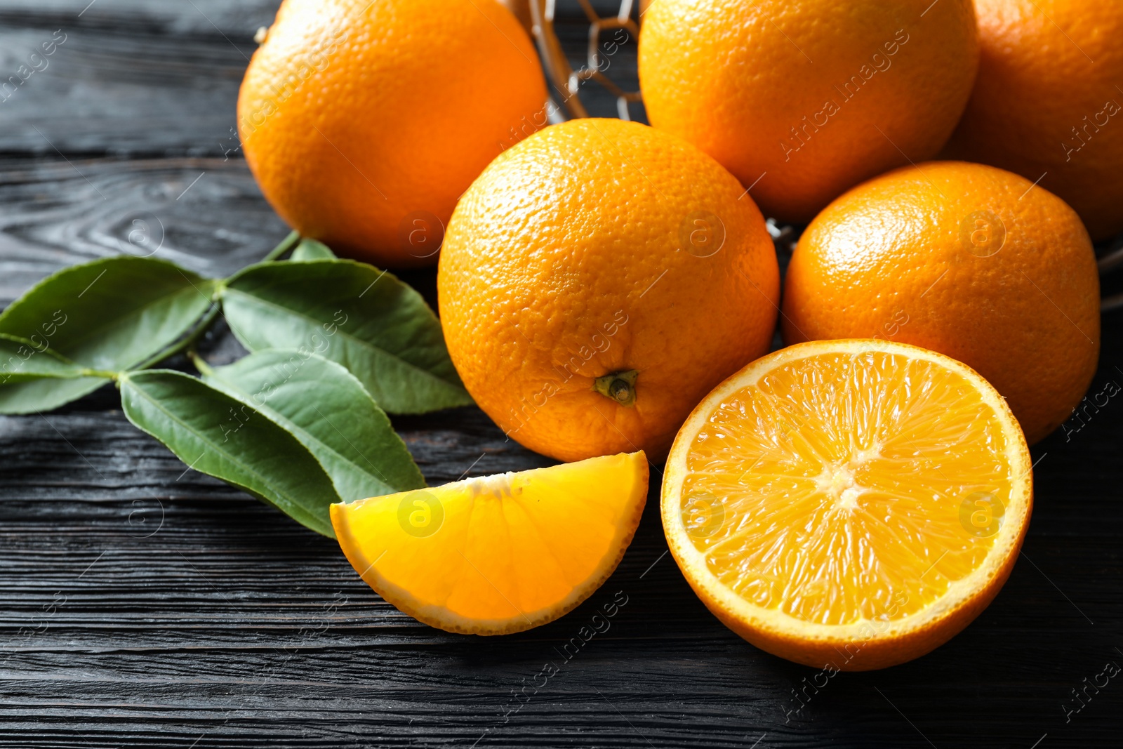 Photo of Fresh ripe oranges on wooden background. Citrus fruits