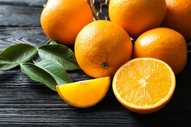 Fresh ripe oranges on wooden background. Citrus fruits