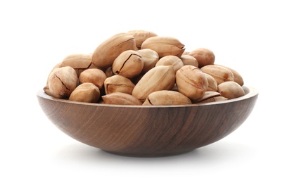 Pecan nuts in bowl on white background. Nutritive food