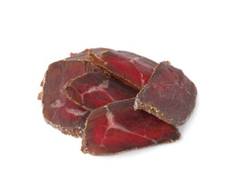 Delicious dry-cured beef basturma slices on white background