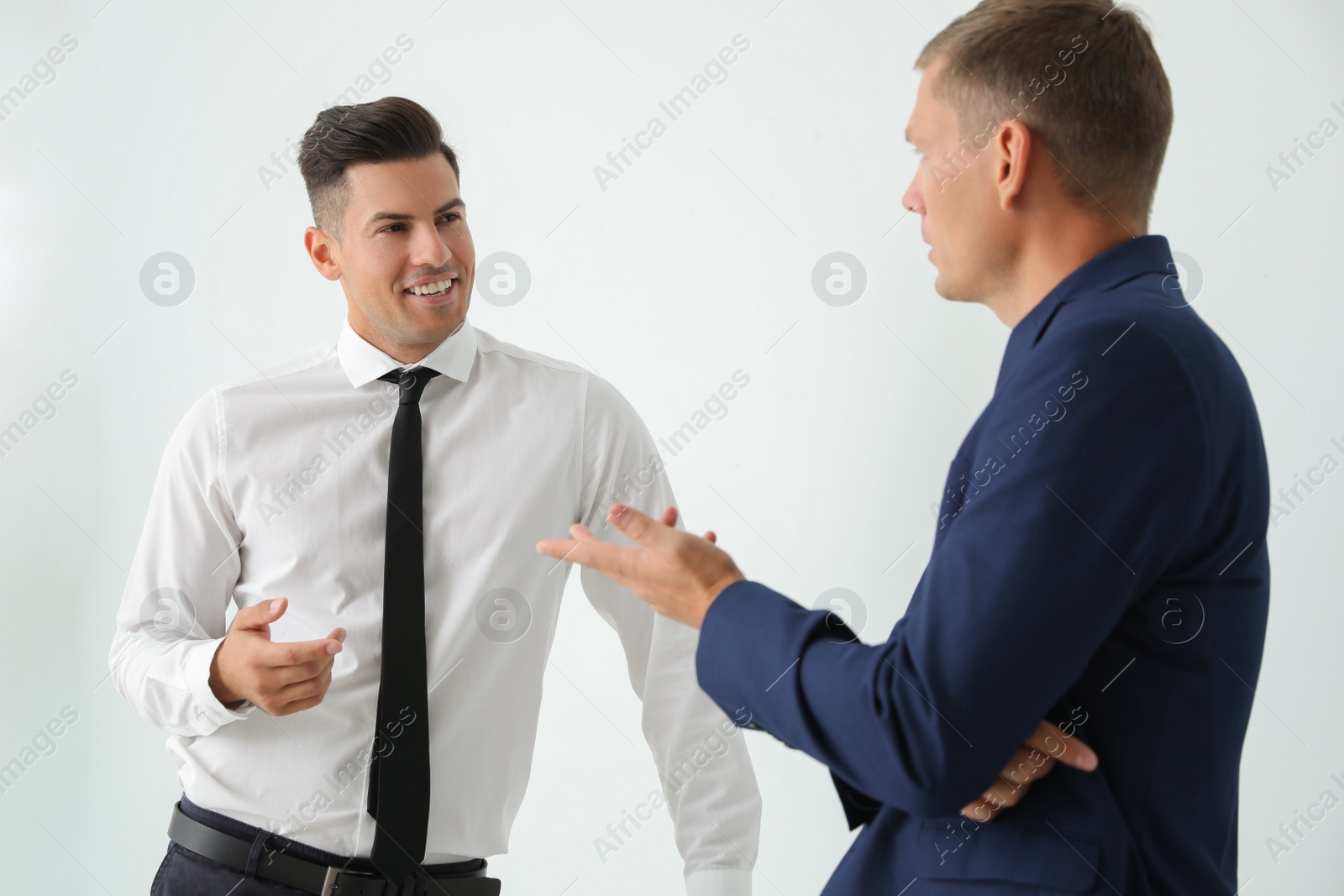 Photo of Office employees talking at workplace during break