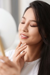 Portrait of woman with perfect skin looking indoors