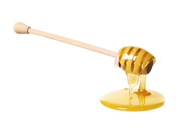 Natural honey dripping from dipper on white background