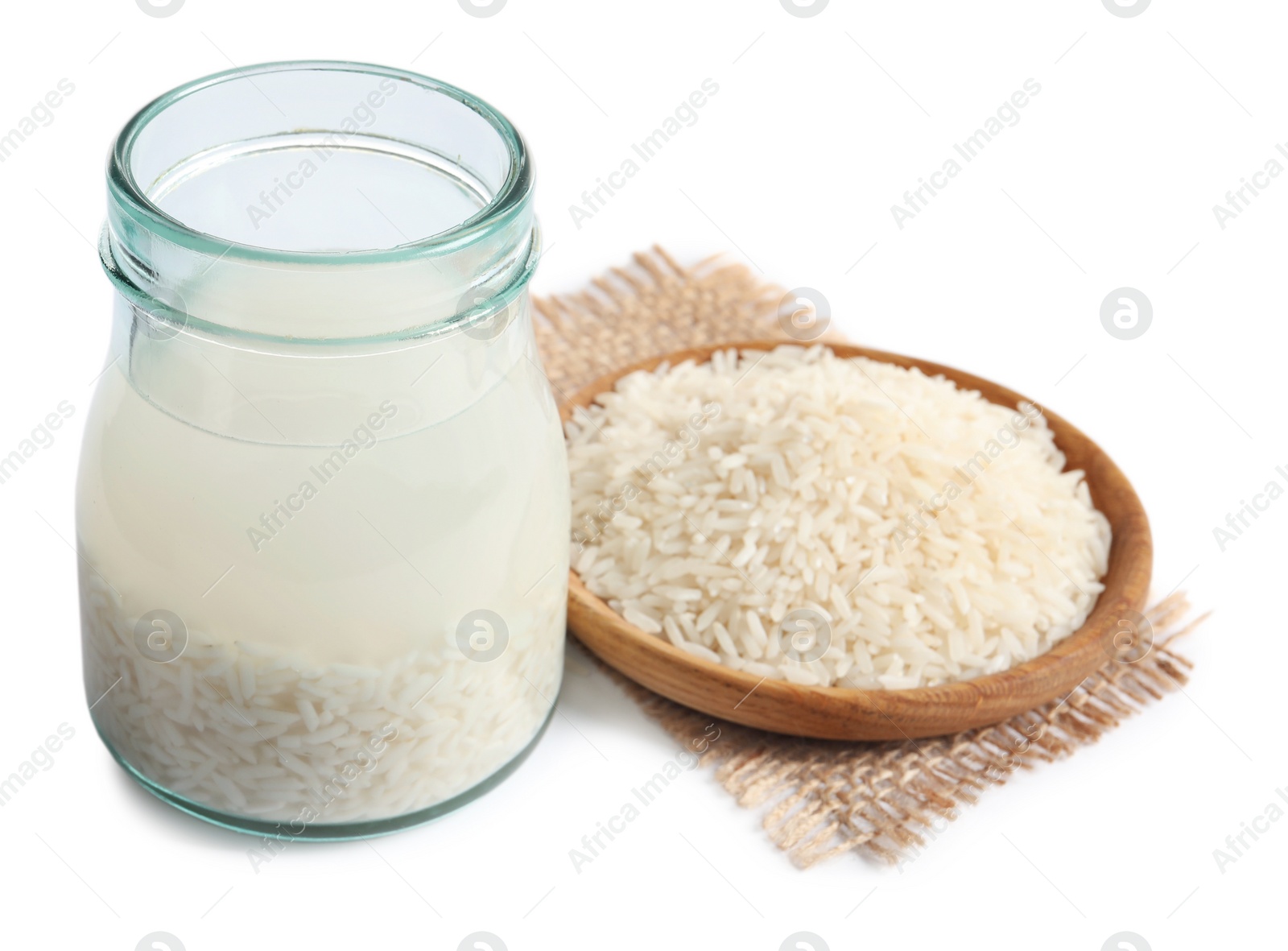 Photo of Rice soaked in water on white background