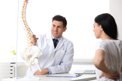 Young woman visiting orthopedist in medical office