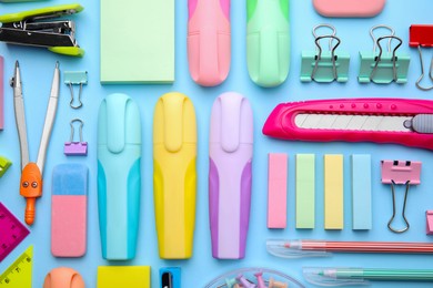 Photo of Many different school stationery on light blue background, flat lay. Back to school