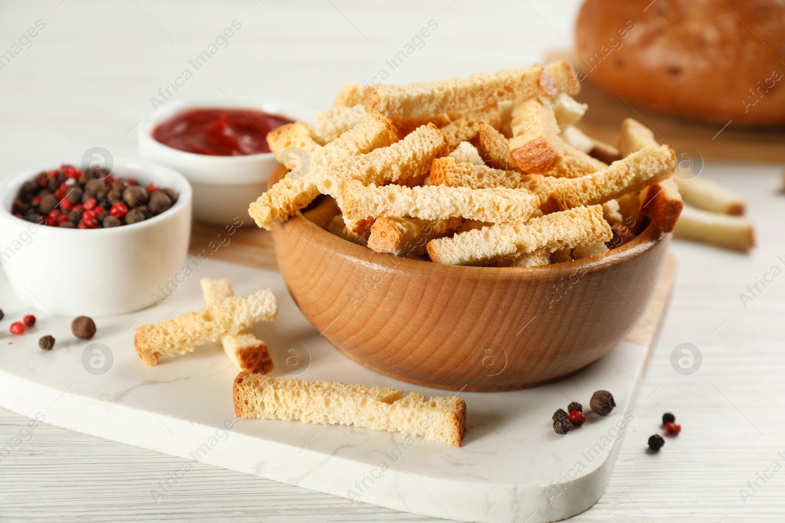 Photo of Delicious hard chucks on white wooden table