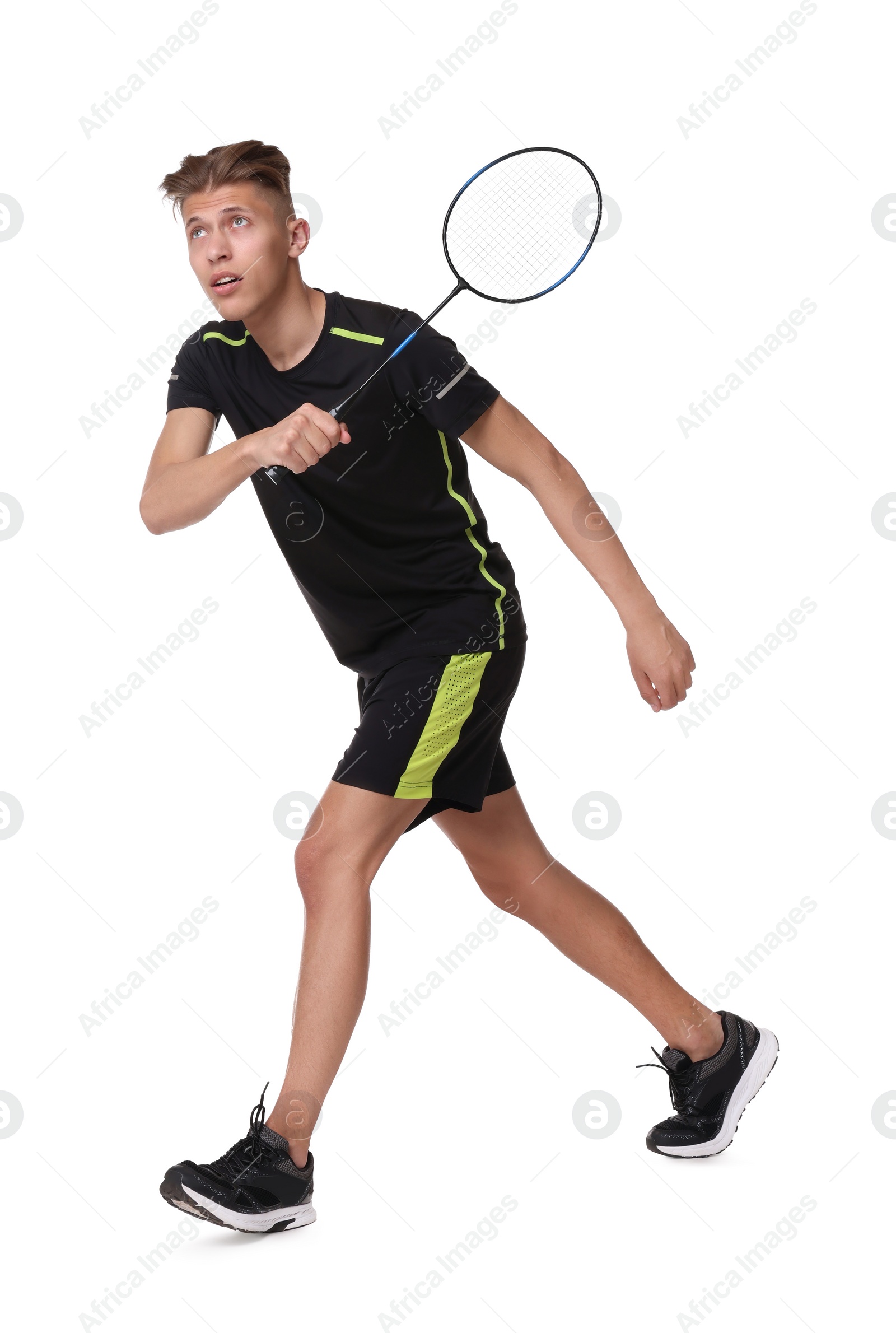 Photo of Young man playing badminton with racket on white background