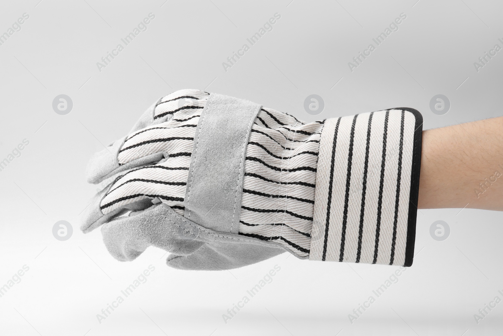 Photo of Woman in gardening glove on white background, closeup