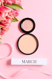 Photo of International Women's day. 8th of March made with makeup powder and beautiful tulips on pink background, flat lay