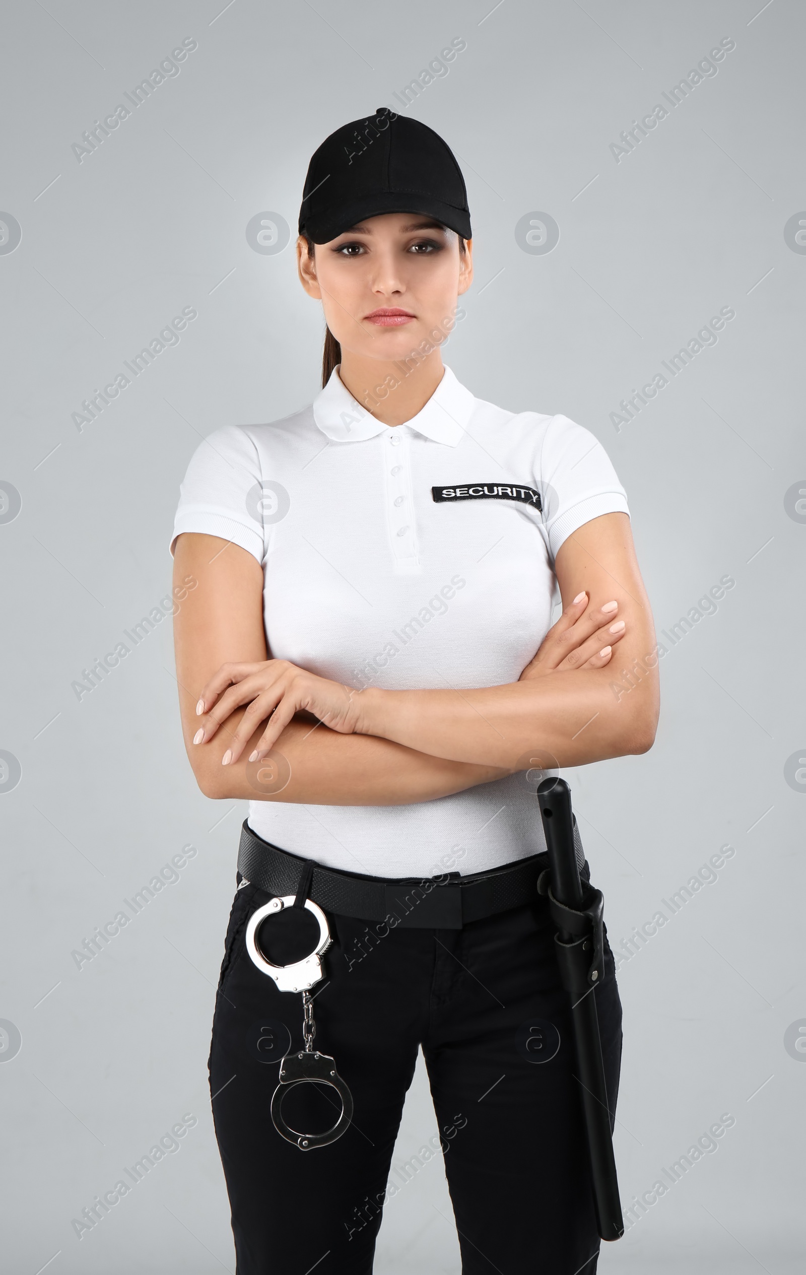 Photo of Female security guard in uniform on color background