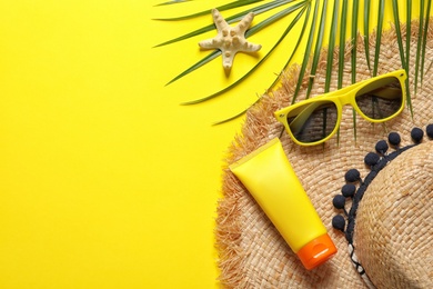 Photo of Flat lay composition with beach accessories on color background. Space for text