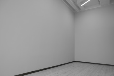 Photo of Empty renovated room with clean light walls