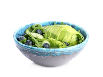 Delicious avocado salad with blueberries in bowl on white background