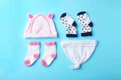 Photo of Flat lay composition with stylish baby clothes on color background