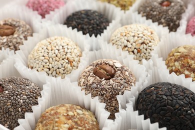 Photo of Assortment of different delicious vegan candy balls, closeup