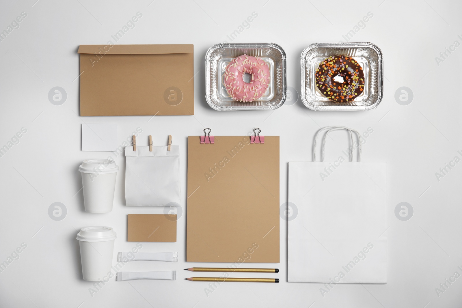 Photo of Flat lay composition with items for mock up design on light background. Food delivery service