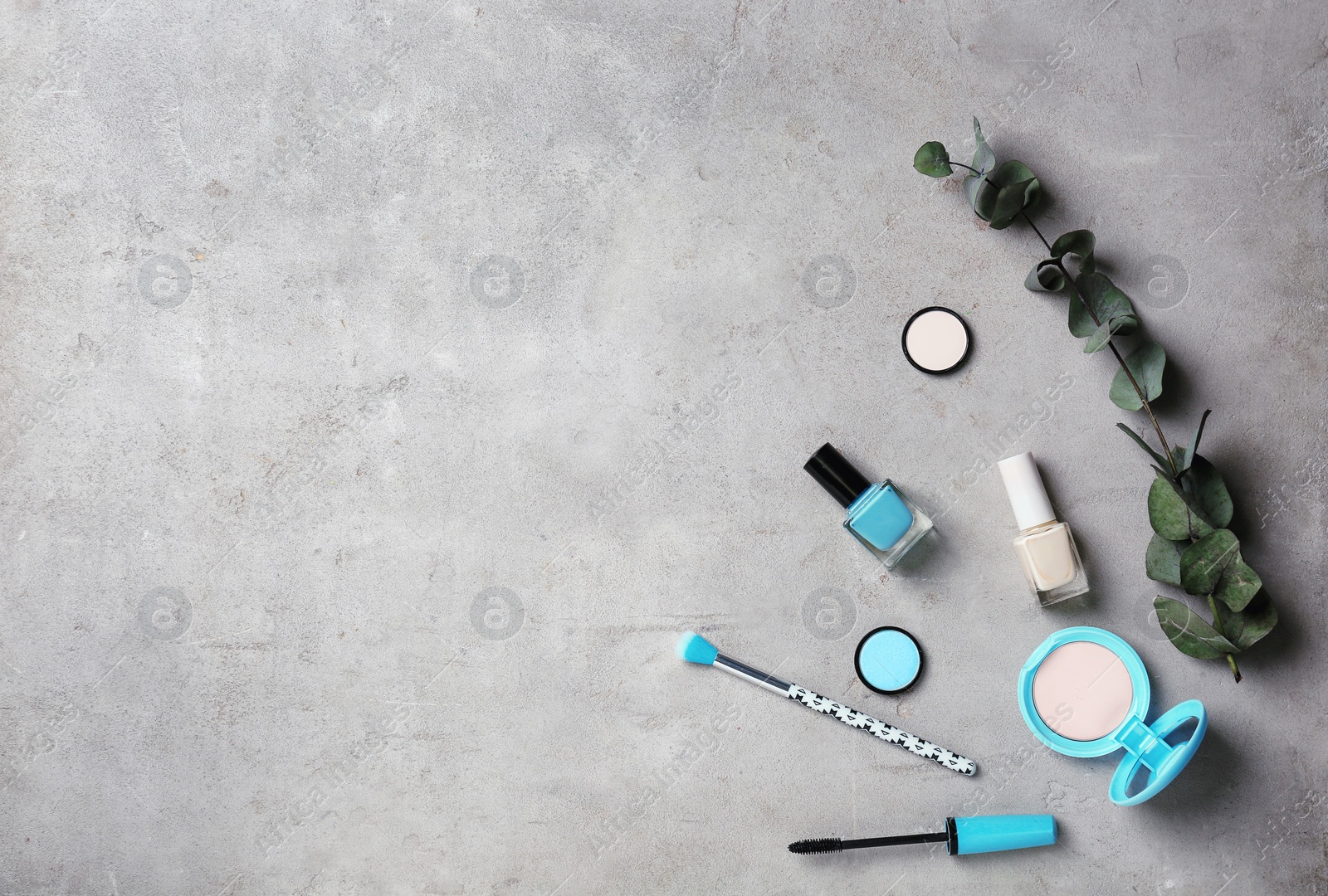 Photo of Flat lay composition with professional makeup products on grey background