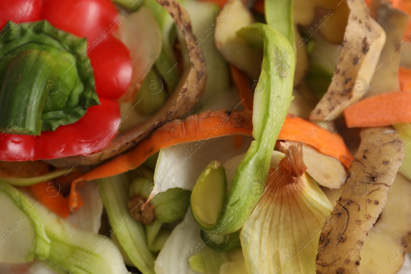 Photo of Peels of fresh vegetables on table, flat lay