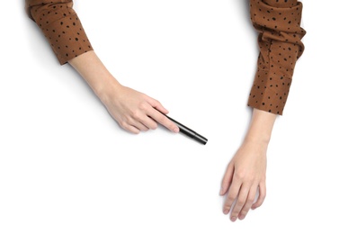 Photo of Woman with marker on white background, top view. Closeup of hands