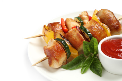 Photo of Delicious chicken shish kebabs with vegetables and ketchup on white background, closeup