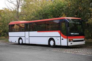 Photo of Modern bus on autumn day outdoors. Public transport