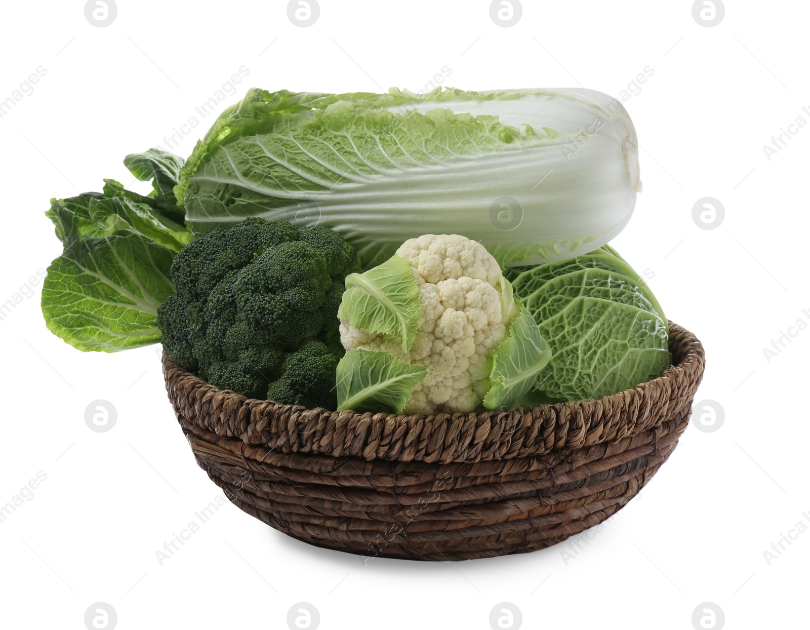 Photo of Wicker bowl with different types of fresh cabbage on white background