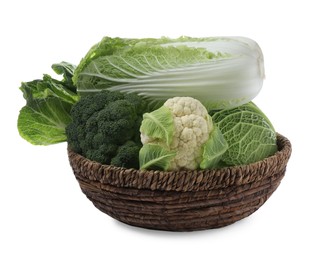 Photo of Wicker bowl with different types of fresh cabbage on white background