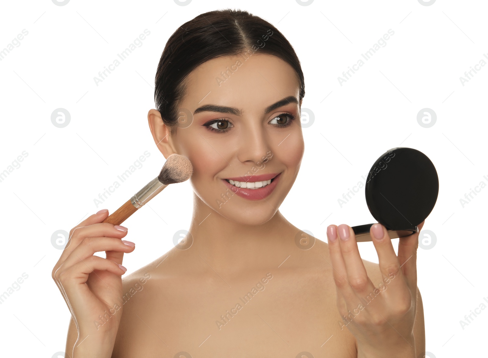 Photo of Beautiful young woman applying face powder with brush on white background