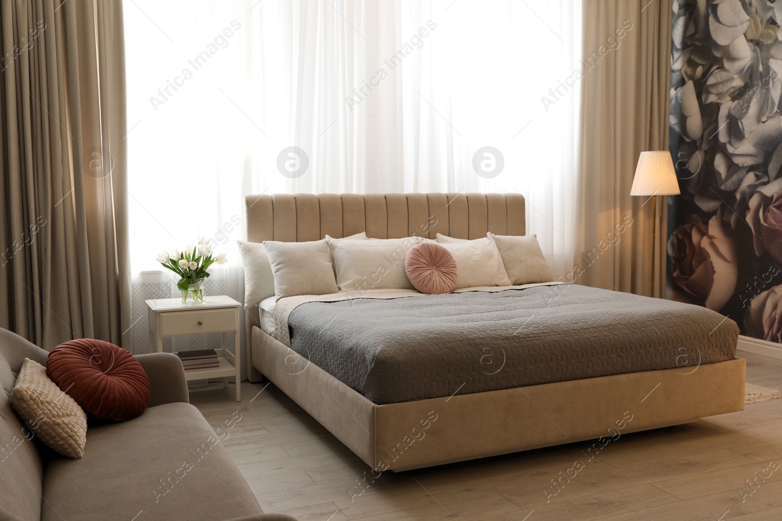 Photo of Beautiful room interior with large comfortable bed