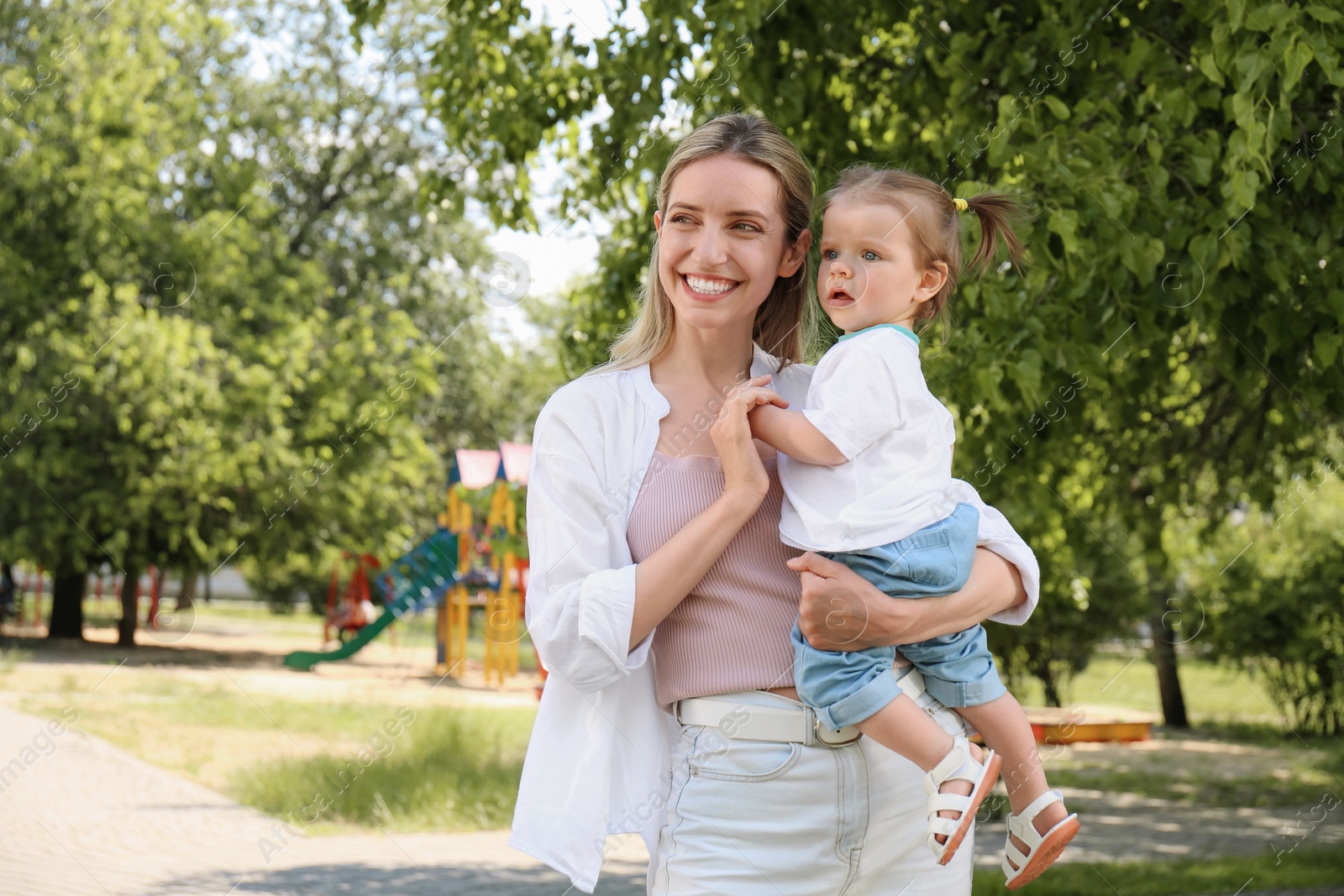 Photo of Happy mother with her daughter spending time together in park