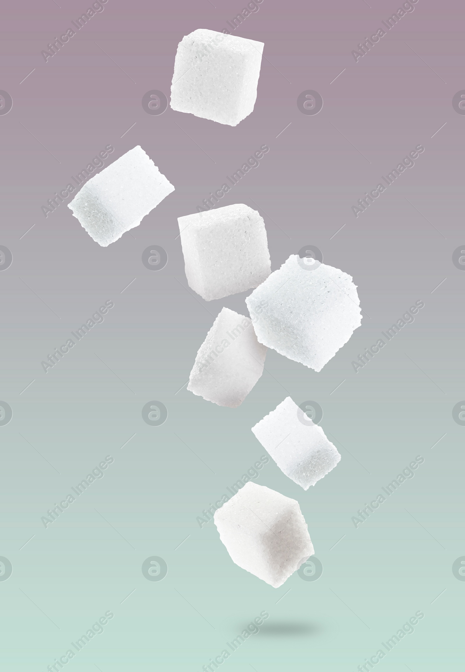 Image of Refined sugar cubes in air on color gradient background