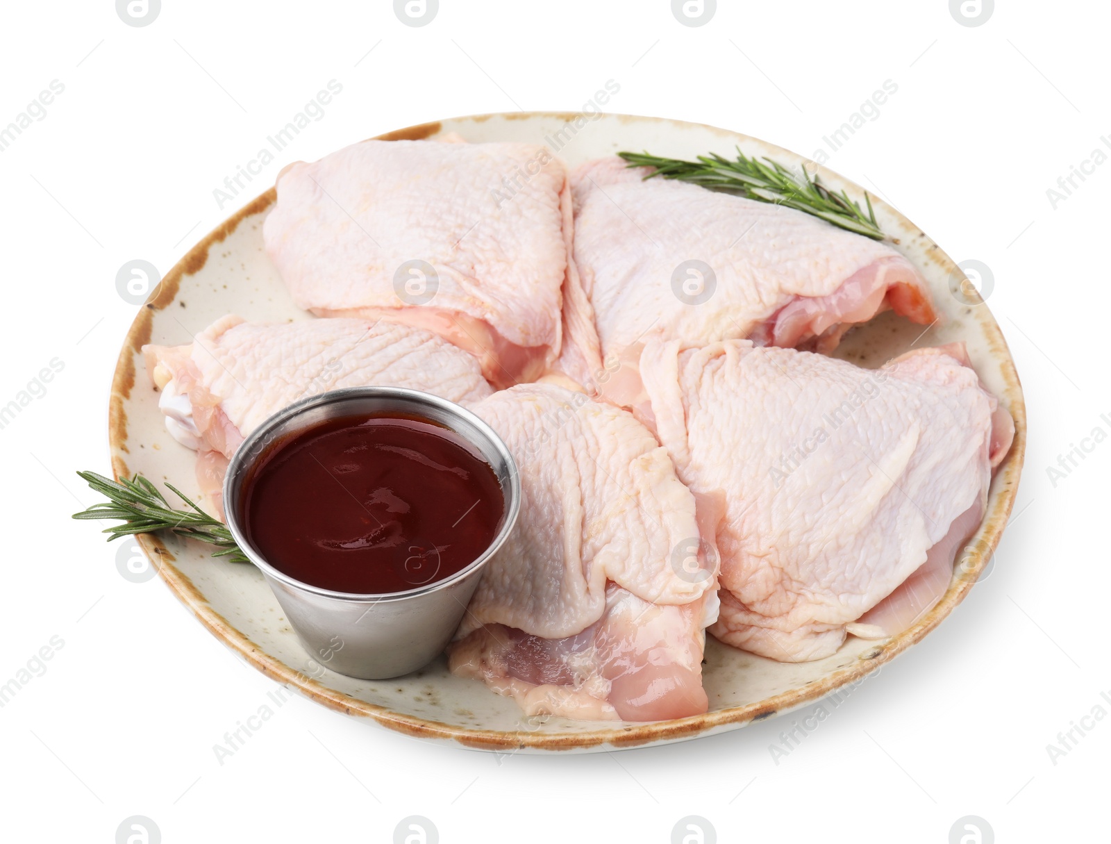 Photo of Plate with marinade, raw chicken and rosemary isolated on white