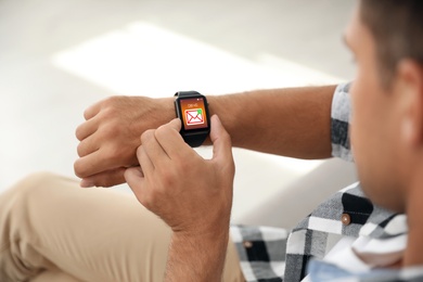 Image of Man with smart watch indoors, closeup view