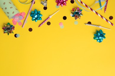 Party popper with confetti, blower and festive decor on orange background, flat lay. Space for text