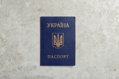 Ukrainian internal passport on grey background, top view