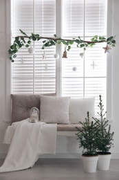 Beautiful room interior decorated for Christmas with potted firs