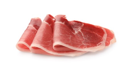 Slices of delicious jamon on white background